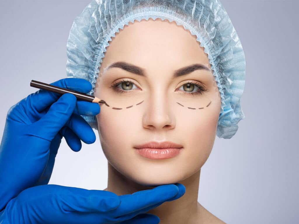 A consultation with a plastic surgeon is recommended to determine the best course of treatment for uneven eyelids and facial asymmetry.