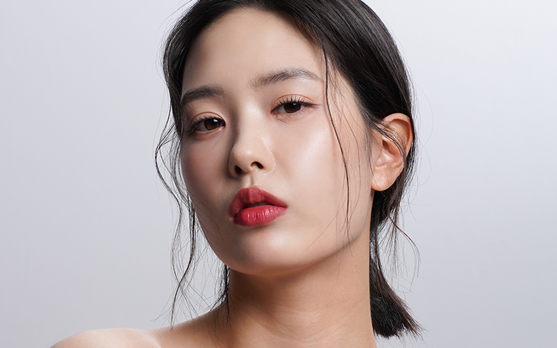 Asian woman with defined nasal tip and enhanced bridge after rhinoplasty preserving ethnic facial harmony