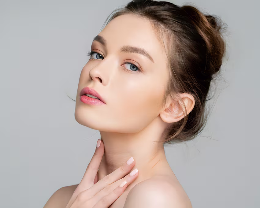 Elegant woman with defined nose and clear skin representing tailored open and closed rhinoplasty techniques at Becker Surgery.