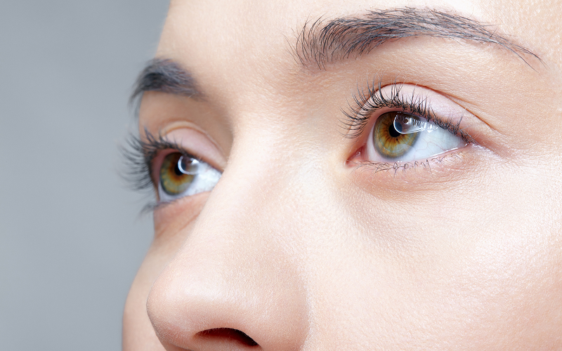 Close-up of eyes showing sagging upper eyelids commonly treated with blepharoplasty in New Jersey and Philadelphia.