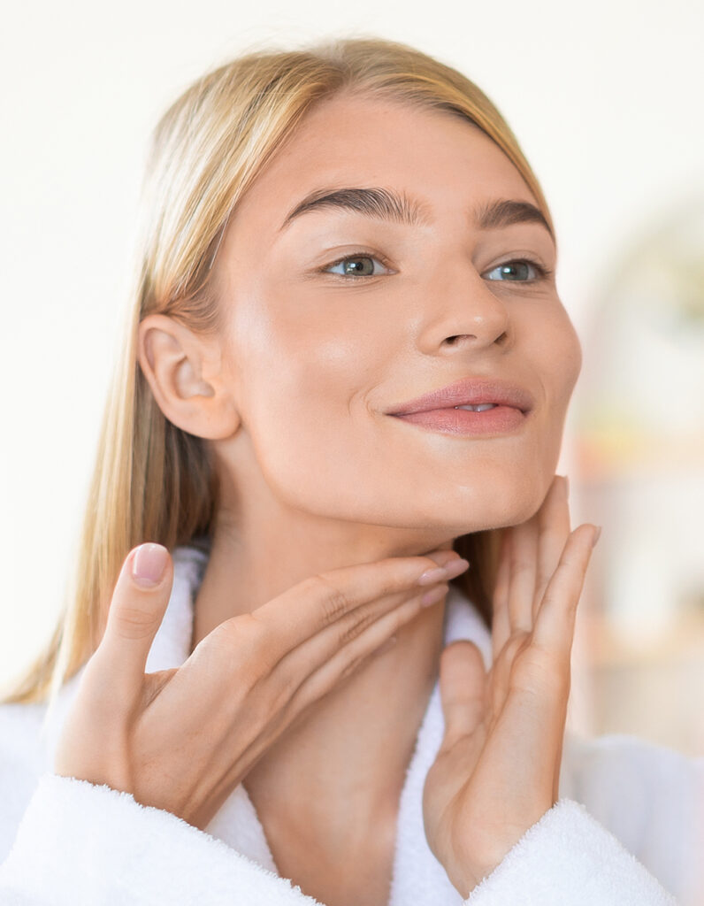 Woman with defined chin and jawline, illustrating chin augmentation results and improved facial harmony.