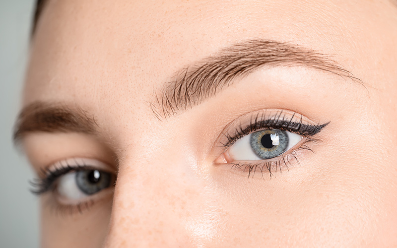 Close-up of natural-looking eyebrow microblading enhancing shape and fullness at Princeton, NJ clinic.