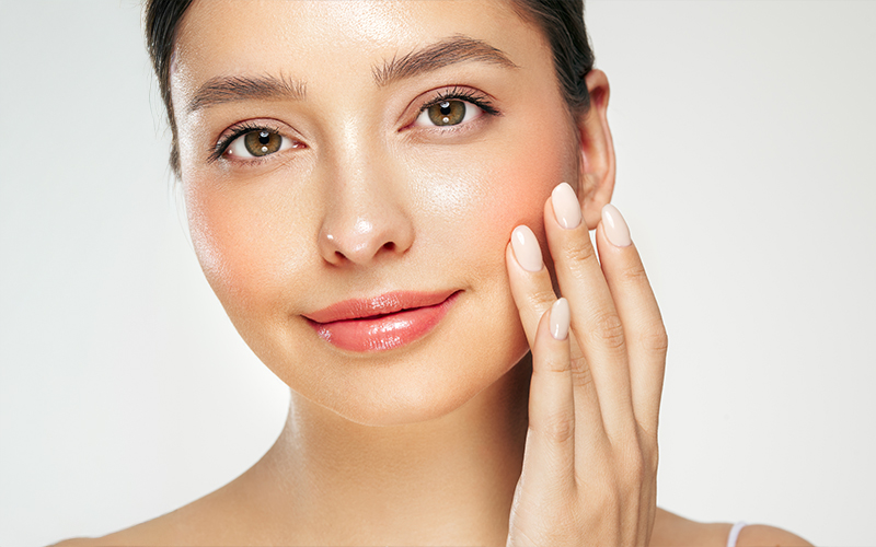 Woman with smooth, youthful facial volume illustrating facial fat grafting results for natural-looking rejuvenation.