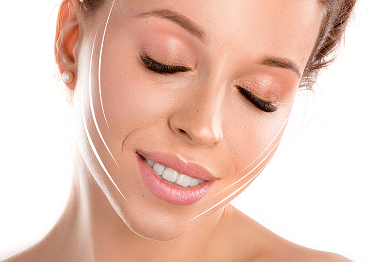 Woman showing smooth, refreshed facial contours representing long-lasting facial fat grafting results.