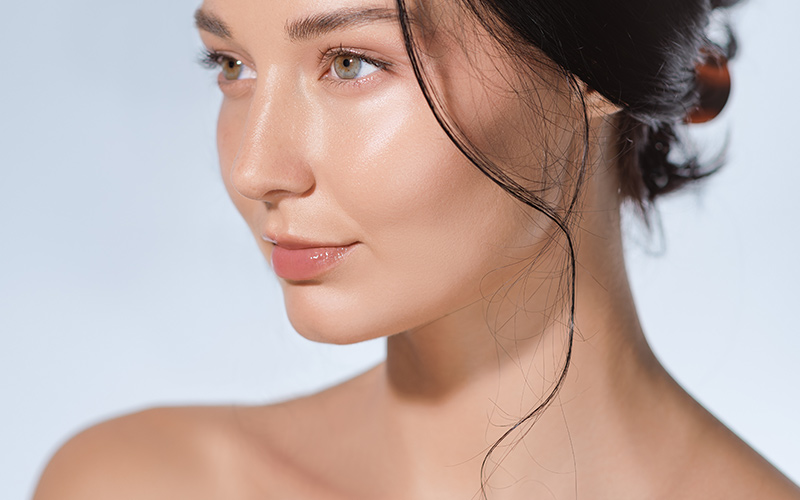 Woman with smooth skin after Jeuveau injectable treatment to reduce facial lines in Philadelphia and New Jersey.