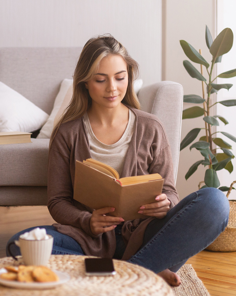 Woman relaxing at home during Jeuveau recovery, following post-treatment care guidelines to support smooth, natural results.