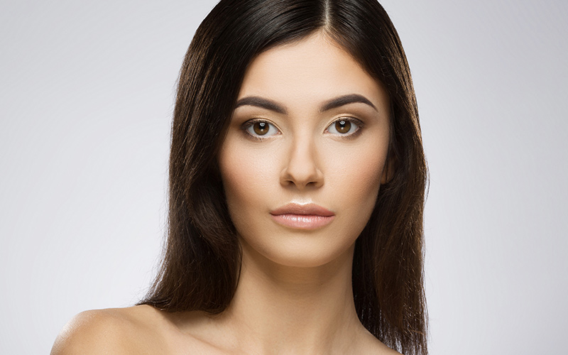 Woman with smooth, radiant skin representing laser resurfacing results.