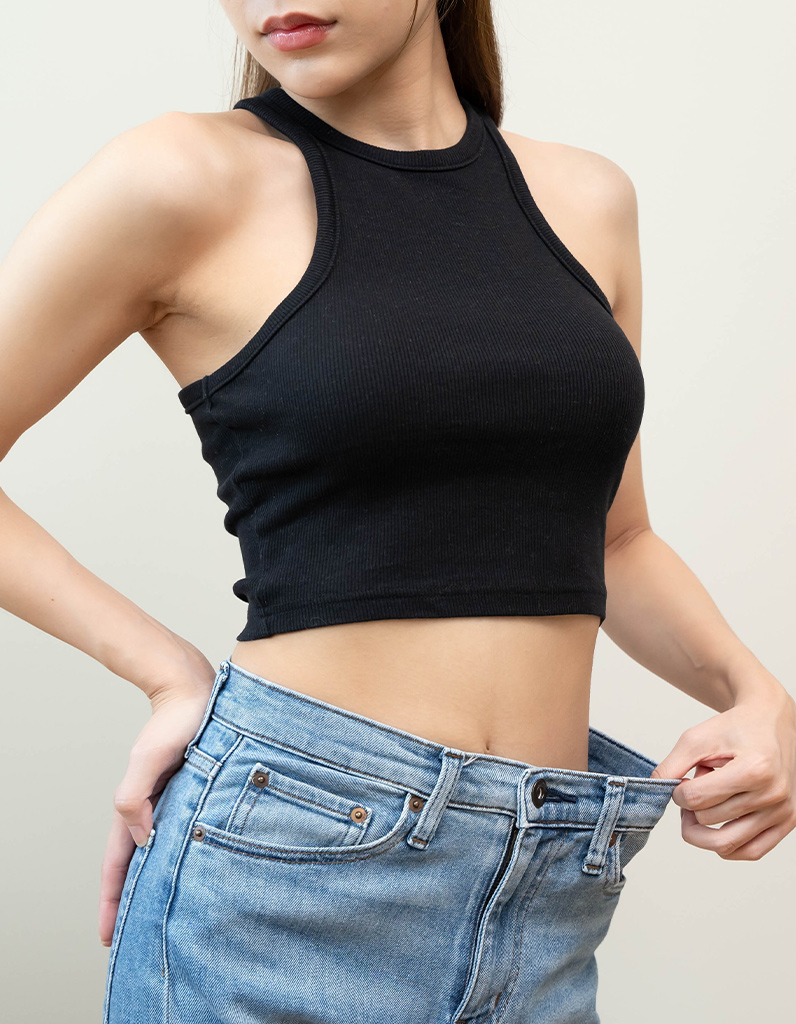 Woman representing ideal candidate for mini tummy tuck procedure.