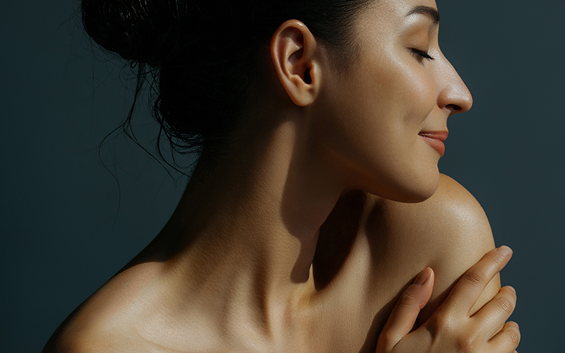 Woman with smooth, firm neck profile representing neck lift results and improved neckline contour.