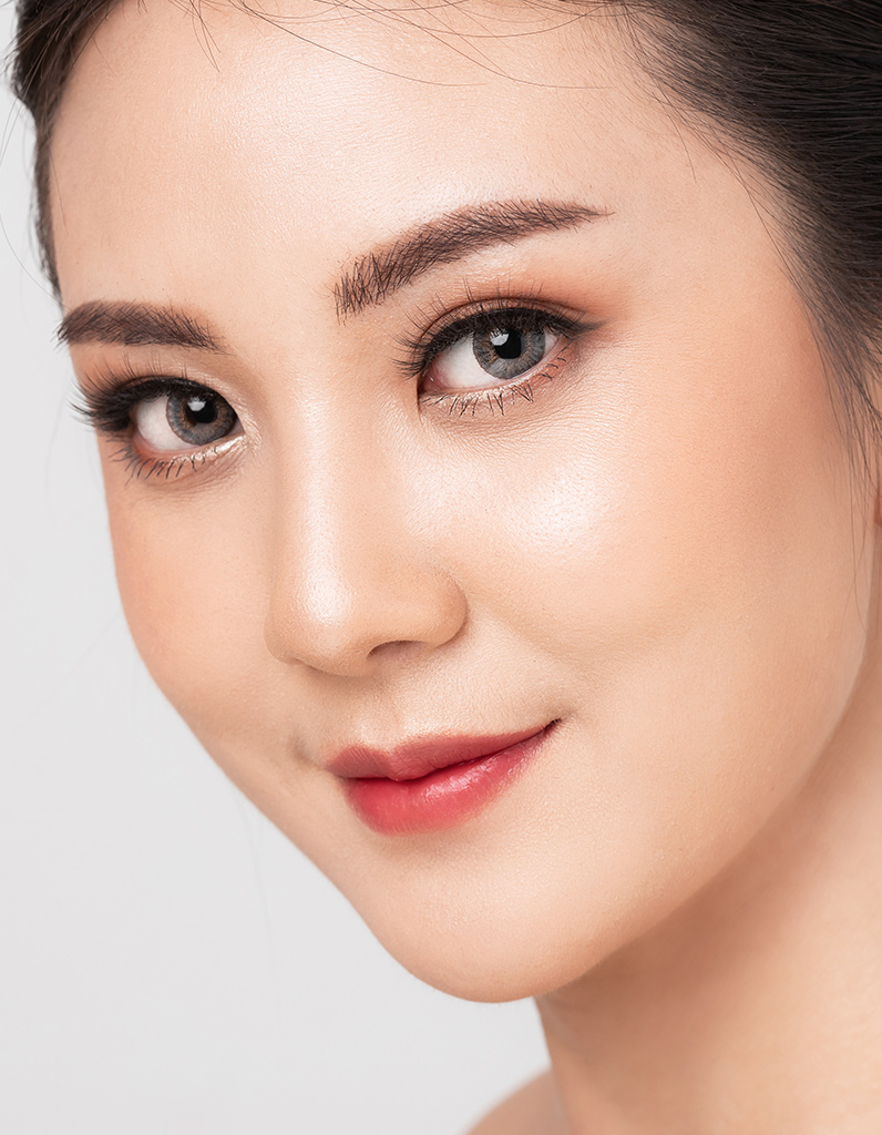 Close-up of smooth skin and enhanced lashes after NovaLash treatment.