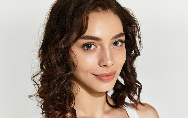 Woman with smooth, glowing skin after customized facial treatment in Princeton, New Jersey.