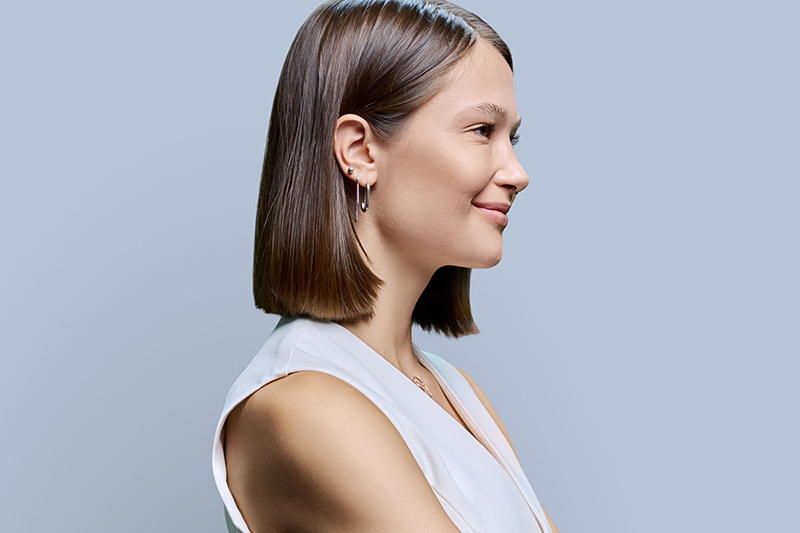 Side profile of woman illustrating balanced nasal projection and facial harmony relevant to rhinoplasty evaluation.