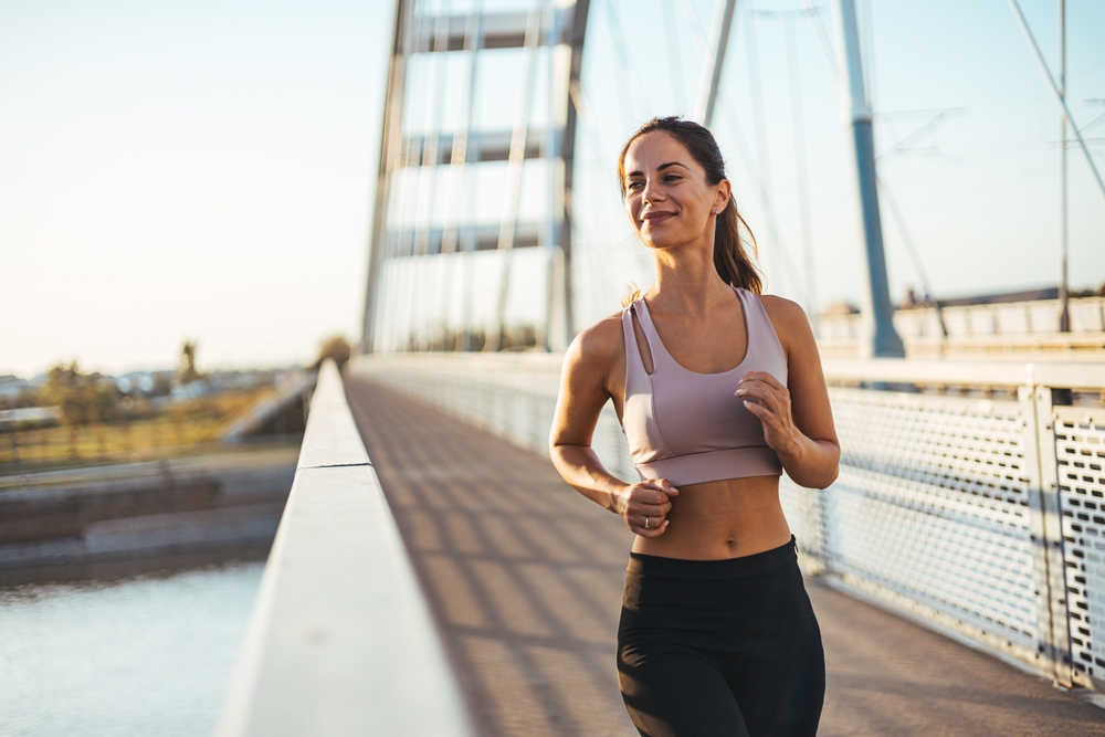 Woman jogging during weeks six to twelve of labiaplasty recovery and advanced healing.